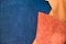 Close up fold suede navy blue and orange leather texture background,fabrics Division