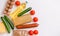 Close-up of food. Vegetables, groceries, cheese and eggs on a white background