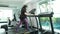 Close up Foot Fitness Asian woman fast walking on track treadmill machine