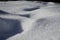 Close up foot path snow field crystals