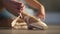 Close-up foot of unrecognizable ballerina tying laces on pointe shoes in slow motion. Young slim confident talented