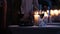 Close-up footage of elegantly decorated table at restaurant, woman holding a glass of red wine, fancy black clutch bag