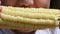 Close up footage-little girl eating boiled corn