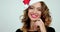 Close-up footage of a young female model in santaâ€™s hat laughing.