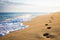 Close up of footprints on sandy beach