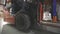 Close-up of a forklift moving through a warehouse. Forklift in motion close-up. Forklift wheels close-up