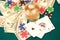 Close up of four of aces, chips and cash on gambling table. Poker concept.