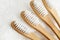 Close up of four bamboo toothbrushes