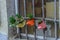 Close up of four flower pots hanging on a window