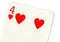 Close up of a four of hearts playing card.