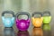 Close-up of four kettlebells of different colors and weights
