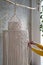 Close up of freelancer woman working on half-finished macrame piece, weaves lamp shade for chandelier. Women hobby