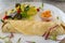 Close up of french crepe wrap with fresh salad and corn salsa relish on the side