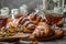 Close up. French croissants with a golden crisp, sprinkled with powdered sugar on top. Next to them is a rosette of jam.