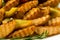 Close-up of French fries or chips, background