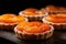 Close-up of fresh apricot tartelettes dessert