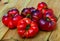 Close-up of fresh brown tomatoes on wooden surface