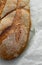 Close-up of fresh crispy tasty oval rye bread on a light background.