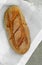 Close-up of fresh crispy tasty oval rye bread on a light background.