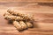 Close up on fresh Crunchy Herbed Whole Wheat Breadsticks multigrain with sunflower seed on wooden table - healthy eating diet