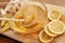 Close up of fresh ginger, lemon, honey in a bowl with dipper on the wooden board, Preparation of cold and flu remedy