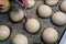 Close-Up of fresh Hamburger Buns, dough. bakery products. production and cooking. Silicone and plastic brush with an egg