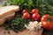 a close-up of fresh herbs, ripe tomatoes, and crusty bread for a deconstructed blt