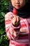 Close-up fresh Japanese strawberry in Cute kid Asian girl hand at strawberry picking farm in Japan