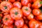 Close up of fresh, juicy, ripe tomatoes pile. lycopene and antioxidant in fruit nutrition good for health and skin. flat lay.