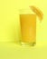 Close Up of Fresh Orange Frozen Granita Slush Drink Garnished with Orange Wedge and Served in Glass with Striped Straw on