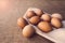 Close up of fresh organic chicken eggs from local farmer market on tablecloth, selective focus. World egg day concept