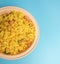 Close up of Fresh Poha or Pohy is a popular Indian breakfast on on bowl