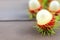 Close up fresh rambutan peeled on wood table with blur rambutan peeled background. Tropical fruit fresh rambutan peeled