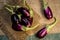 Close up of fresh raw egg plant,Solanum melongena or Brinjal in a traditional basket on gunny background.