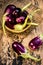 Close up of fresh raw egg plant,Solanum melongena or Brinjal in a traditional basket on gunny background.