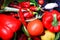 Close up of fresh red vegetable bell pepper, tomato, chilis in waste bin