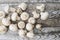 Close-up of fresh, ripe mushrooms on white wood background