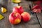 Close up fresh Ripe organic red apples with water drops on the rustic wooden table. Space for text. Selective focus. Autumn harves