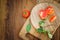 Close-up of fresh, ripe tomatoes on wood background