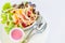 Close up fresh salad with boiled chicken and strawberry on bucket on white background