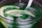 Close up of a fresh summer drink, mint with soda, ice cubes and