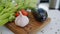 Close-up of fresh vegetables tomatoes, celery, eggplant and garlic on wooden board