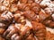 close-up of freshly baked buns and croissants on a store counter