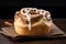 Close-up freshly baked cinnabon roll with sweet glaze on a black background. Generated AI