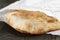 Close up of freshly baked flat pita bread