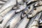 A close-up of freshly caught mackerel on ice on a market stall