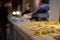 Close up of freshly made ravioli pasta at food counter at Mercato Mayfair, food market in restored St Mark`s Church, Mayfair UK