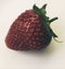 Close up of a freshly picked juicy strawberry