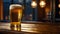 Close-up of a freshly poured glass of light beer with foam on a bar counter