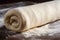 close-up of freshly rolled pizza dough, ready for topping
